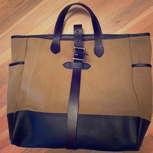 Large Filson tote. Leather handle and buckle